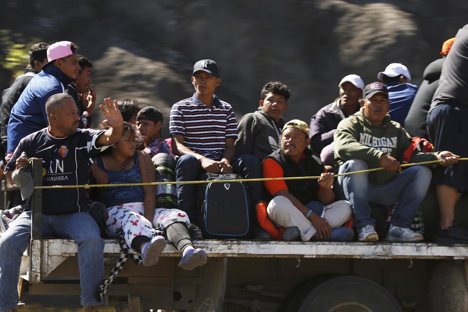 Central American migrants moving as a caravan toward the U.S. border get a free ride on a truck from Guadalajara, Mexico, Tuesday, Nov. 13, 2018. Many say they are fleeing rampant poverty, gang violence and political instability primarily in the Central American countries of Honduras, Guatemala, El Salvador and Nicaragua. (AP Photo/Marco Ugarte)