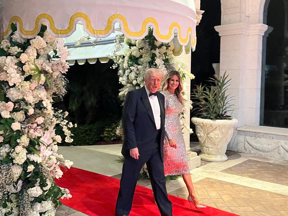 Donald and Melania Trump walk the red carpet on their way to the New Year's Eve gala at mar-a-Lago on Dec. 31, 2022.