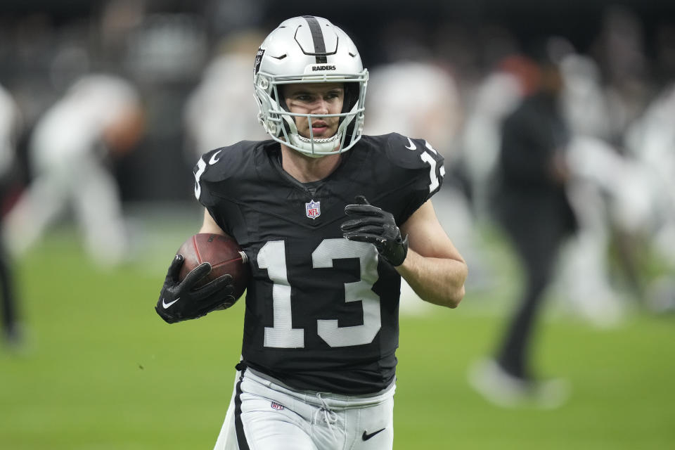 FILE - Las Vegas Raiders wide receiver Hunter Renfrow warms up before an NFL football game, Jan. 7, 2024, in Las Vegas. The Las Vegas Raiders have released Renfrow less than two years after signing him to a lucrative contract extension.nHe confirmed the long-expected decision on social media on Wednesday, March 13, 2024. (AP Photo/John Locher, File)