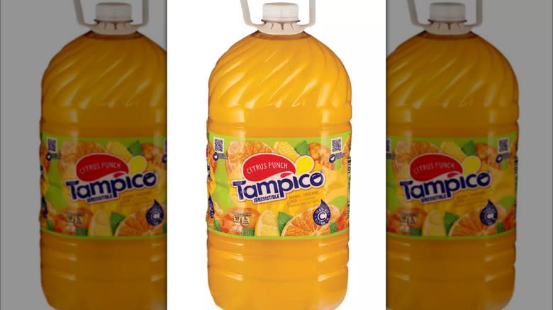 Bottles of orange-colored juice