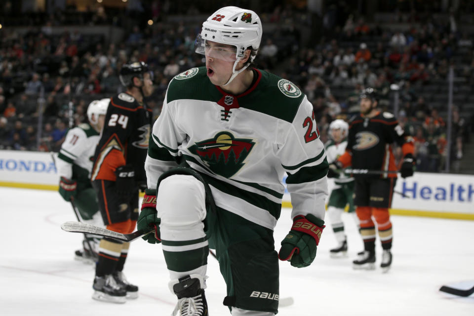 Minnesota Wild left wing Kevin Fiala, center, of Switzerland, reacts after scoring against the Anaheim Ducks during the first period of an NHL hockey game in Anaheim, Calif., Sunday, March 8, 2020. (AP Photo/Alex Gallardo)