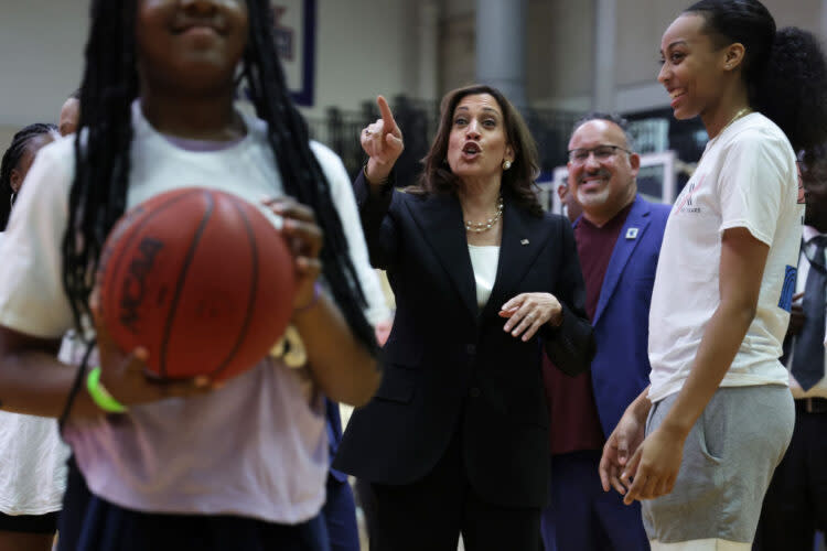 Vice President Kamala Harris and Education Secretary Miguel Cardona watch schoolgirls playing basketball during a Title IX 50th Anniversary Field Day event at American University Wednesday. (Alex Wong/Getty Images)