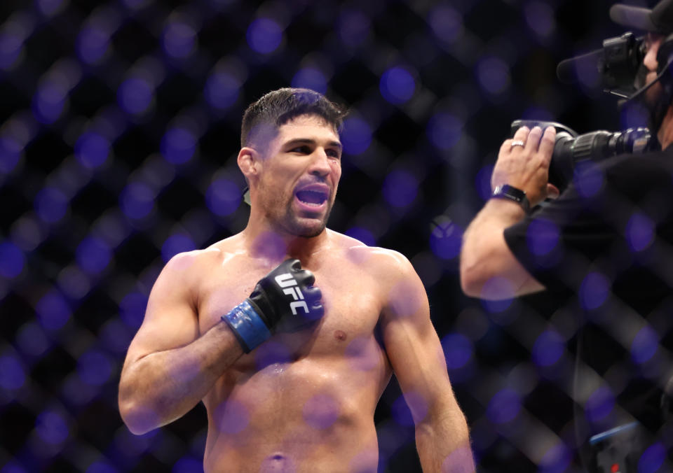 Aug 7, 2021; Houston, Texas, USA; Vicente Luque (blue gloves) reacts to the fight against Michael Chiesa (red gloves) during UFC 265 at Toyota Center. Mandatory Credit: Troy Taormina-USA TODAY Sports