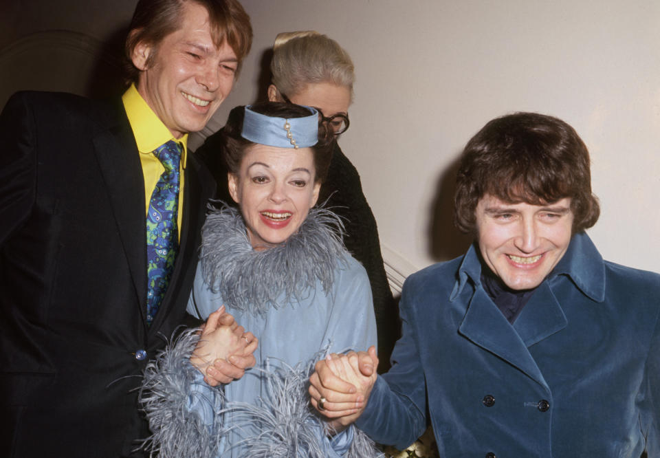 American entertainer Judy Garland and New York businessman Mickey Deans (r) after their wedding at Chelsea Register Office, London. With them (l) is singer Johnny Ray who was the best man.