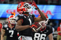 Georgia wide receiver George Pickens (1) celebrates his touchdown catch against Cincinnati during the first half of the Peach Bowl NCAA college football game, Friday, Jan. 1, 2021, in Atlanta. (AP Photo/Brynn Anderson)