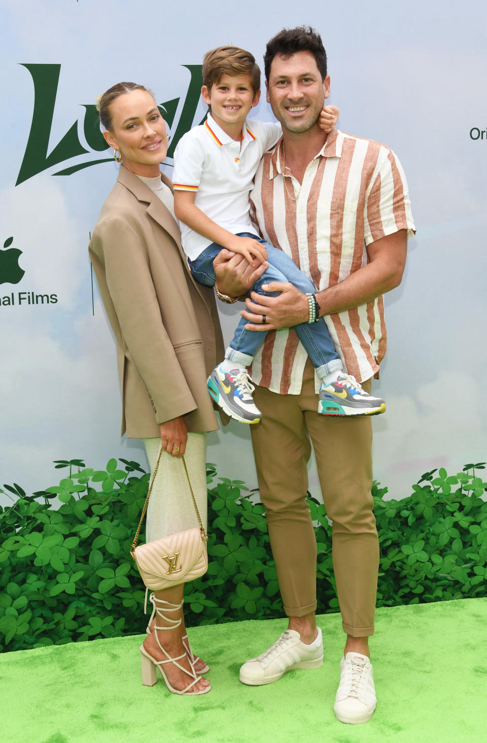 LOS ANGELES, CALIFORNIA - JULY 30: (L-R) Peta Murgatroyd, Shai Chmerkovskiy and Maks Chmerkovskiy attend Apple Original Films' "Luck" Premiere Event at Regency Village Theatre on July 30, 2022 in Los Angeles, California. (Photo by Jon Kopaloff/WireImage)