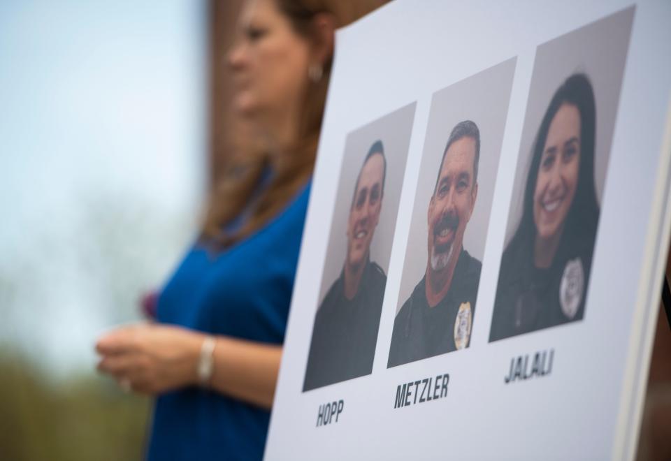 Photos of Loveland police officers involved in the arrest of Karen Garner are on display following the announcement that two Loveland police officers will face criminal charges following the arrest of the 73-year-old woman with dementia during a press conference with Garner's family outside the Police and Courts Building in Loveland, Colo. on Wednesday, May 19, 2021. 