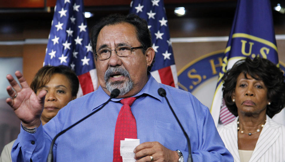 FILE - Congressional Progressive Caucus co-chair, Rep. Raul Grijalva, D-Ariz., center, expresses his disapproval of the debt ceiling agreement during a news conference on Capitol Hill in Washington, Aug. 1, 2011. Listening at back are Rep. Barbara Lee, D-Calif., left, and Rep. Maxine Waters, D-Calif. Lessons learned from the debt ceiling standoff more than a decade ago are rippling through Washington. Back in 2011 the debate around raising the debt ceiling was eerily familiar. Newly elected House Republicans were eager to confront the Democratic president and force spending cuts. (AP Photo/Manuel Balce Ceneta, File)