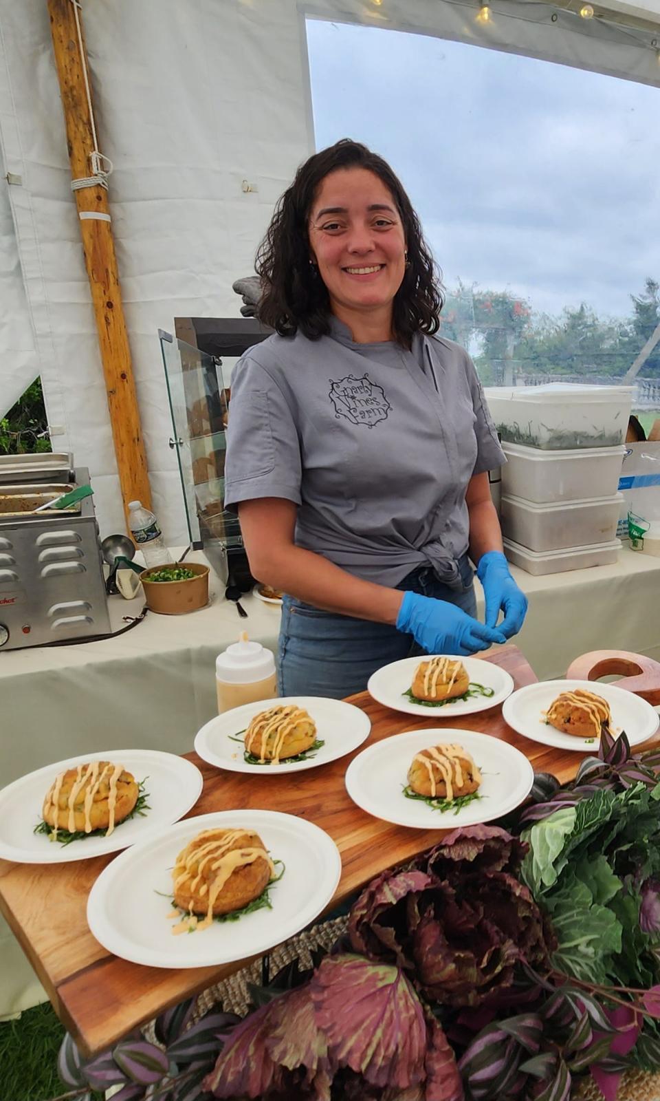 Gnarly Vine's Farm's Ester Bishop, shown here, and Joe Bishop are among Farm Fresh R.I.'s farmers of fauna, pasture-raising animals on 16 acres of coastal land in Tiverton
