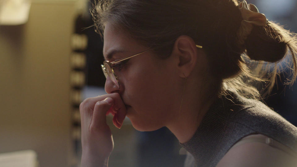 closeup of a woman's profile as she's in thought