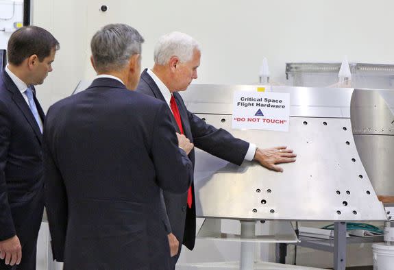 Vice President Mike Pence, right, gets a tour of the Orion clean room with Sen. Marco Rubio, left, by Bob Cabana, Director Kennedy Space Center, center, Thursday, July 6, 2017.