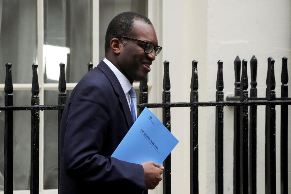 Kwasi Kwarteng walks outside Downing Street