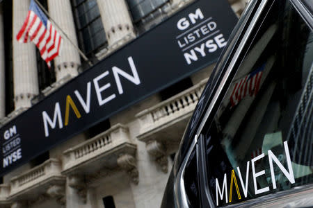 FILE PHOTO: A sign for General Motors Co. car-sharing operation, Maven hangs on the facade of the New York Stock Exchange (NYSE) in New York, U.S., May 15, 2017. REUTERS/Brendan McDermid/File Photo