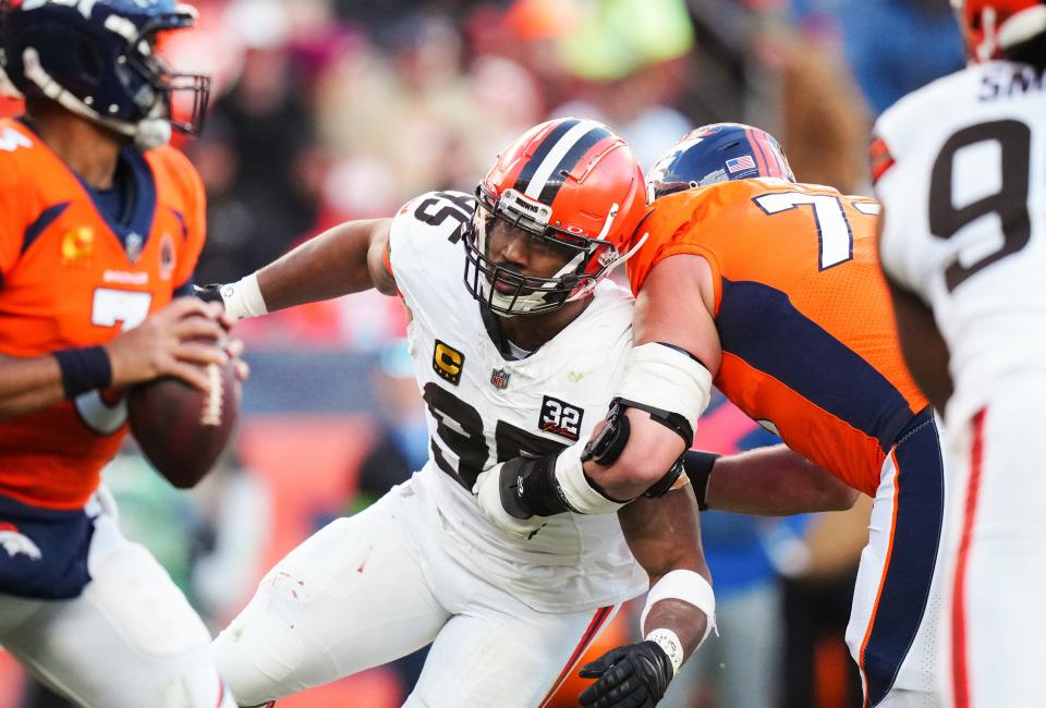 Browns defensive end Myles Garrett drives past Broncos offensive tackle Garett Bolles on Nov. 26, 2023, in Denver.