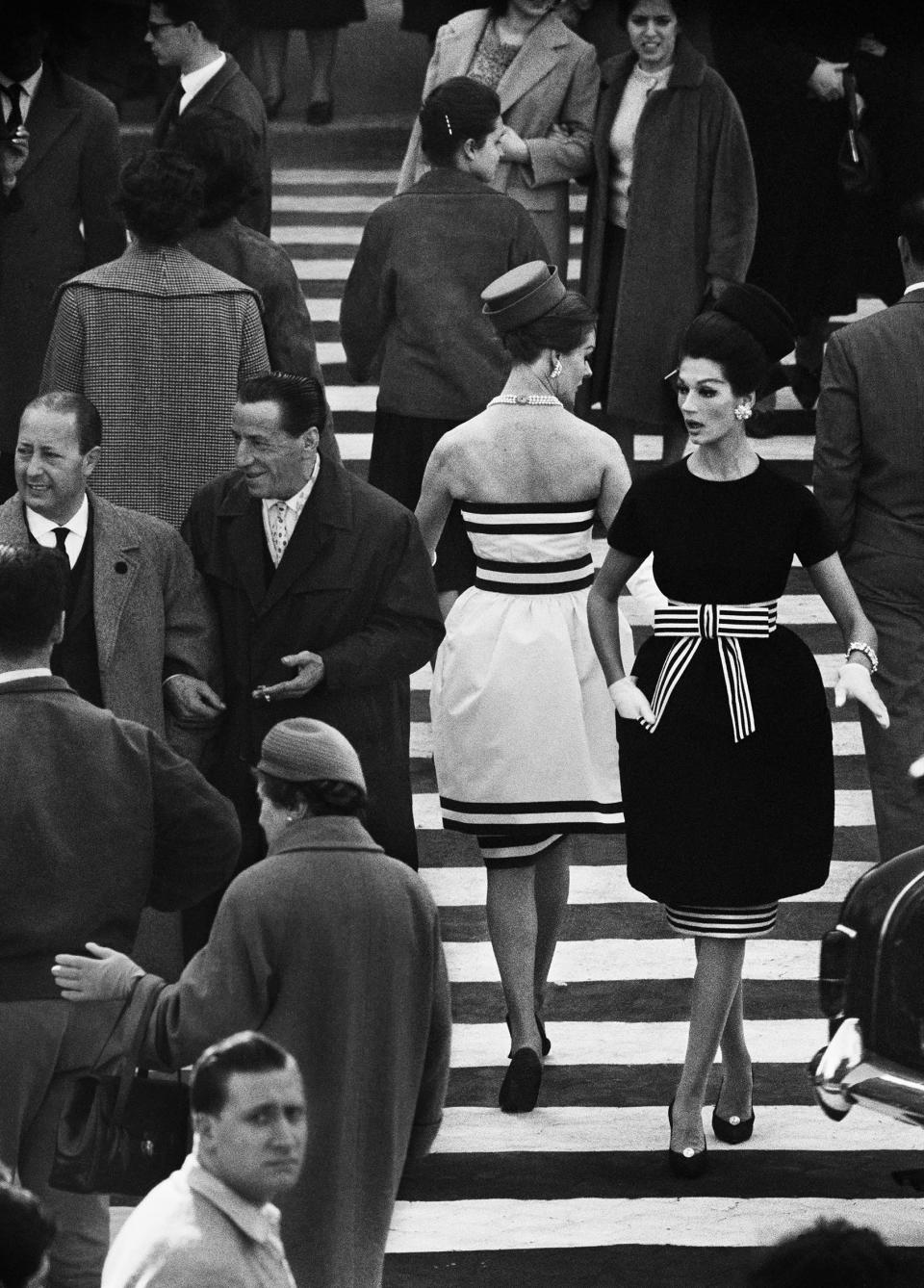 Using a telephoto lens and a radio for communications to shoot from afar, only the models were aware they were being photographed for “Nina and Simone, Piazza di Spagna; Rome, 1960.” - Credit: Photo by William Klein, Courtesy Howard Greenberg Gallery