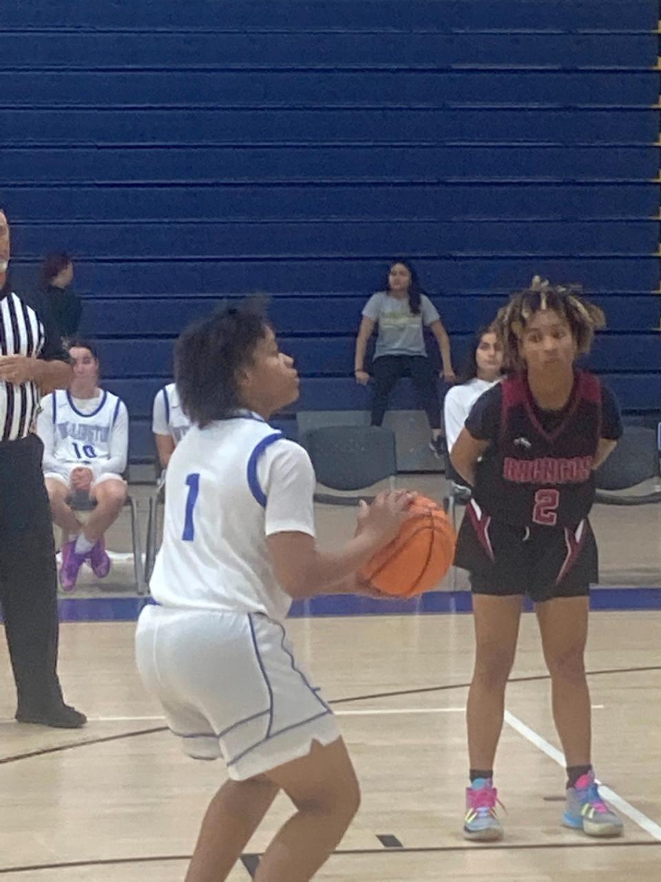 Wellington's Dayna Clarke shoots a free throw against Palm Beach Central on Wednesday, Dec. 6, 2023.