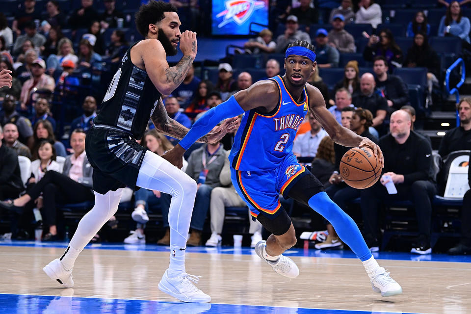 Shai Gilgeous-Alexander of the Oklahoma City Thunder plays against Julian Champagnie of the San Antonio Spurs at the Paycom Center in Oklahoma City on April 10, 2024. (Photo by Joshua Gately/Getty Images)