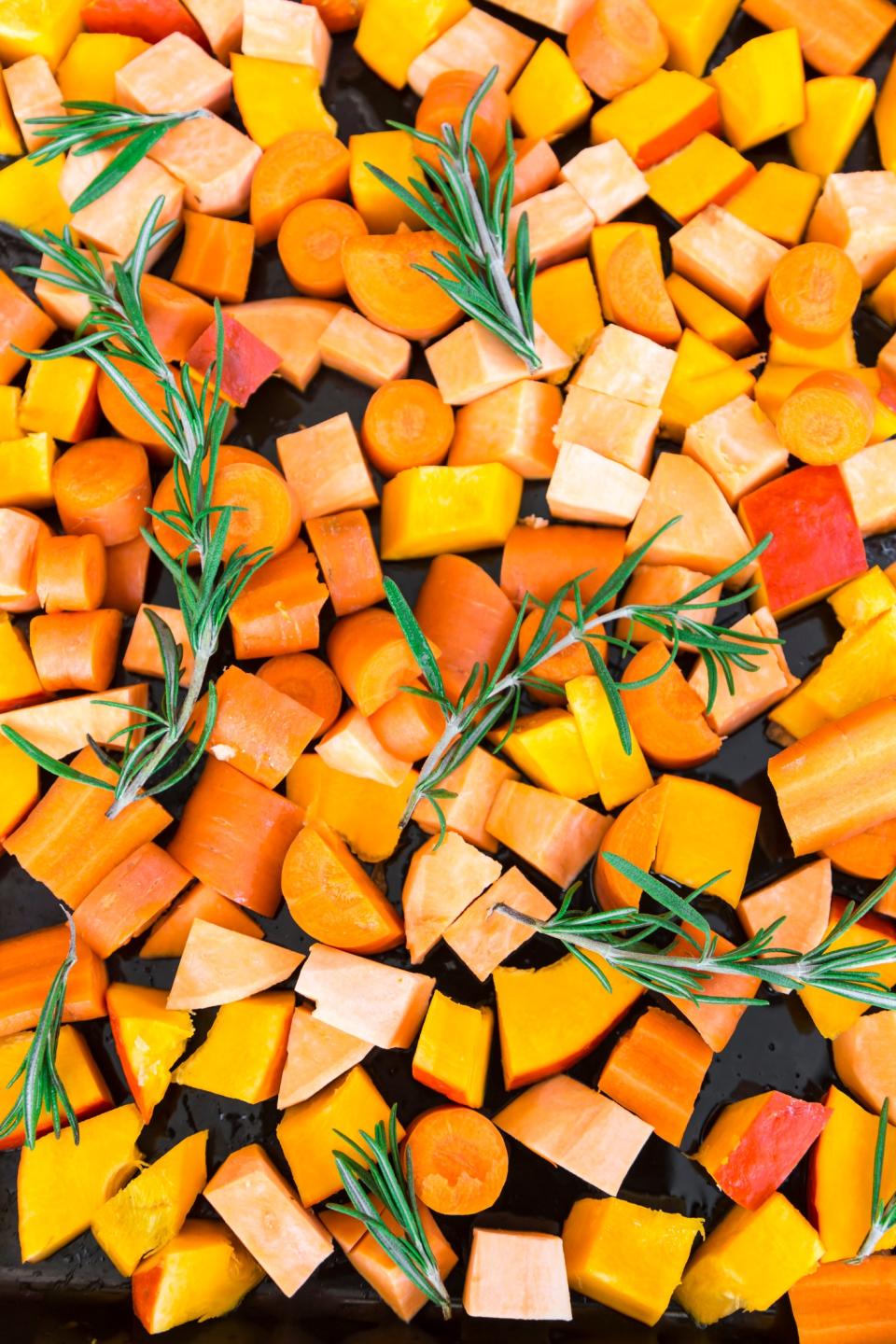 <h1 class="title">Sliced pumpkin, carrots and sweet potatoes with twigs of rosemary on baking tray</h1><cite class="credit">Westend61</cite>