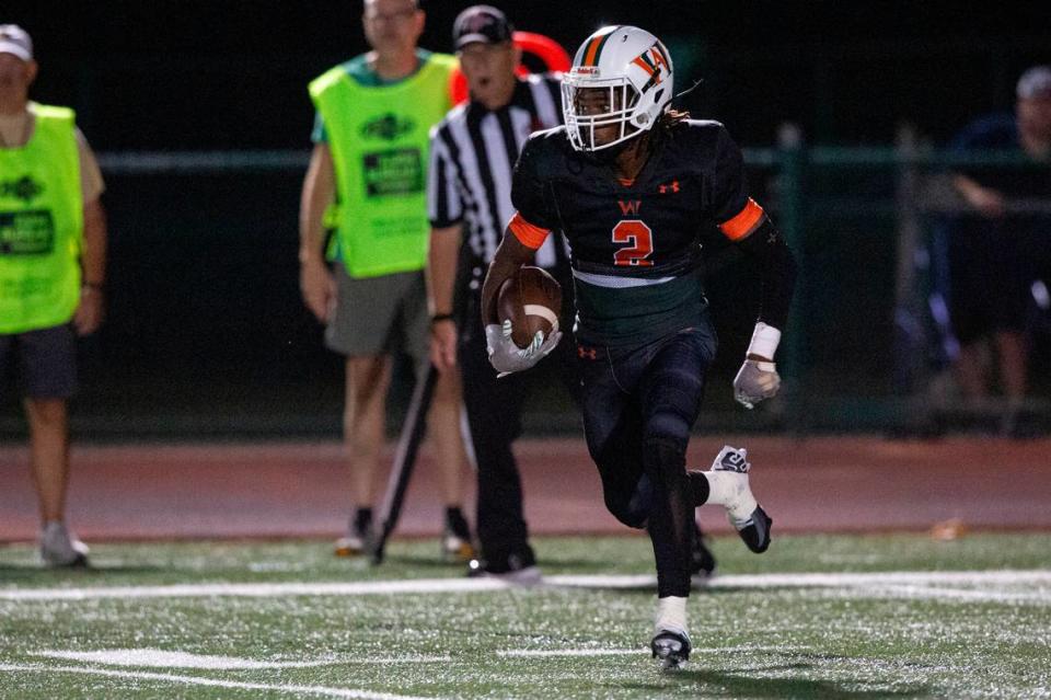 West Harrison’s Tyson Johnson runs the ball down the field during a game against Hancock at West Harrison High School in Harrison County on Friday, Oct. 6, 2023.