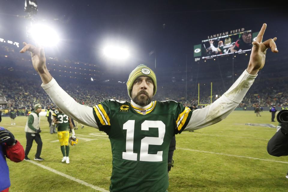 Green Bay Packers' Aaron Rodgers celebrates as he walks off the field after an NFL divisional playoff football game against the Seattle Seahawks Sunday, Jan. 12, 2020, in Green Bay, Wis. The Packers won 28-23 to advance to the NFC Championship. (AP Photo/Mike Roemer)