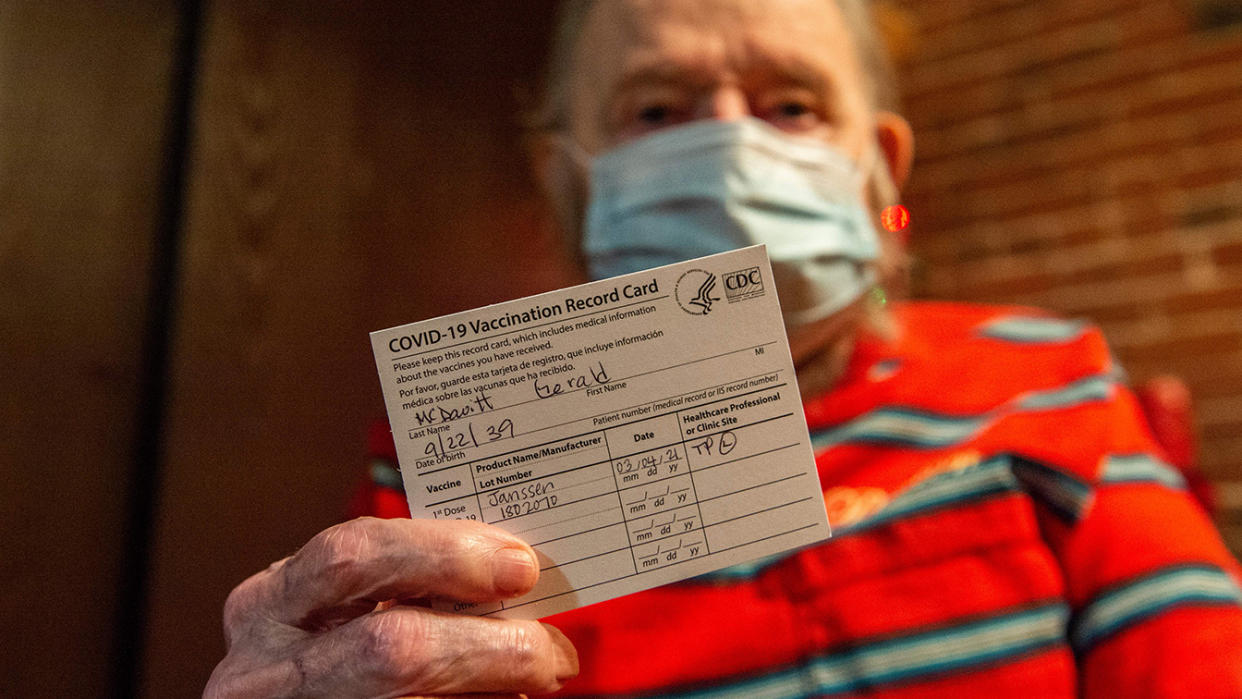 Gerald McDavitt, 81, a Veteran of the United States Army Corps of Engineers, holds his CDC vaccine card after being inoculated with the Johnson & Johnson Covid-19 Janssen Vaccine at his home in Boston, Massachusetts on March 4, 2021. (Joseph Prezioso/AFP via Getty Images)