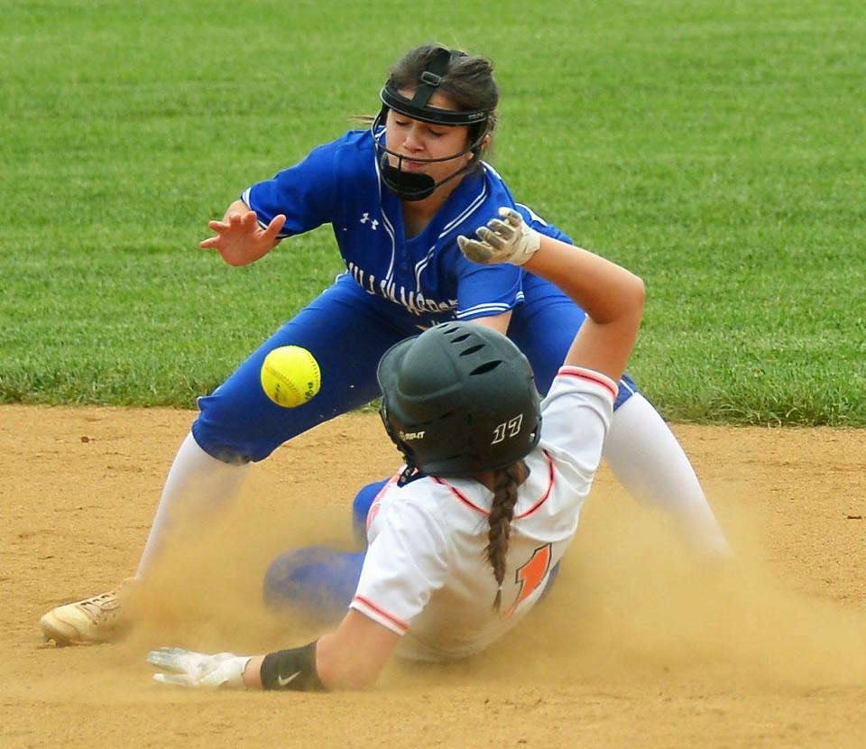 Boonsboro runner Ava Nelson slides safely into second base before the ball arrives to Williamsport third baseman Emily Kopp to advance on a throw after a two-run single. Nelson's hit gave Boonsboro a 6-2 lead as Kopp was forced cover the base on the play.