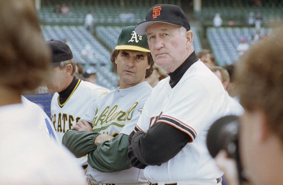 American League manager Tony La Russa, left, from the Oakland A's and National League manager Roger Craig of the San Francisco Giants watch batting practice together, Tuesday, July 10, 1990, before the start of the 61st All Star Game at Wrigley field in Chicago. (AP Photo/Robert Kozloff)