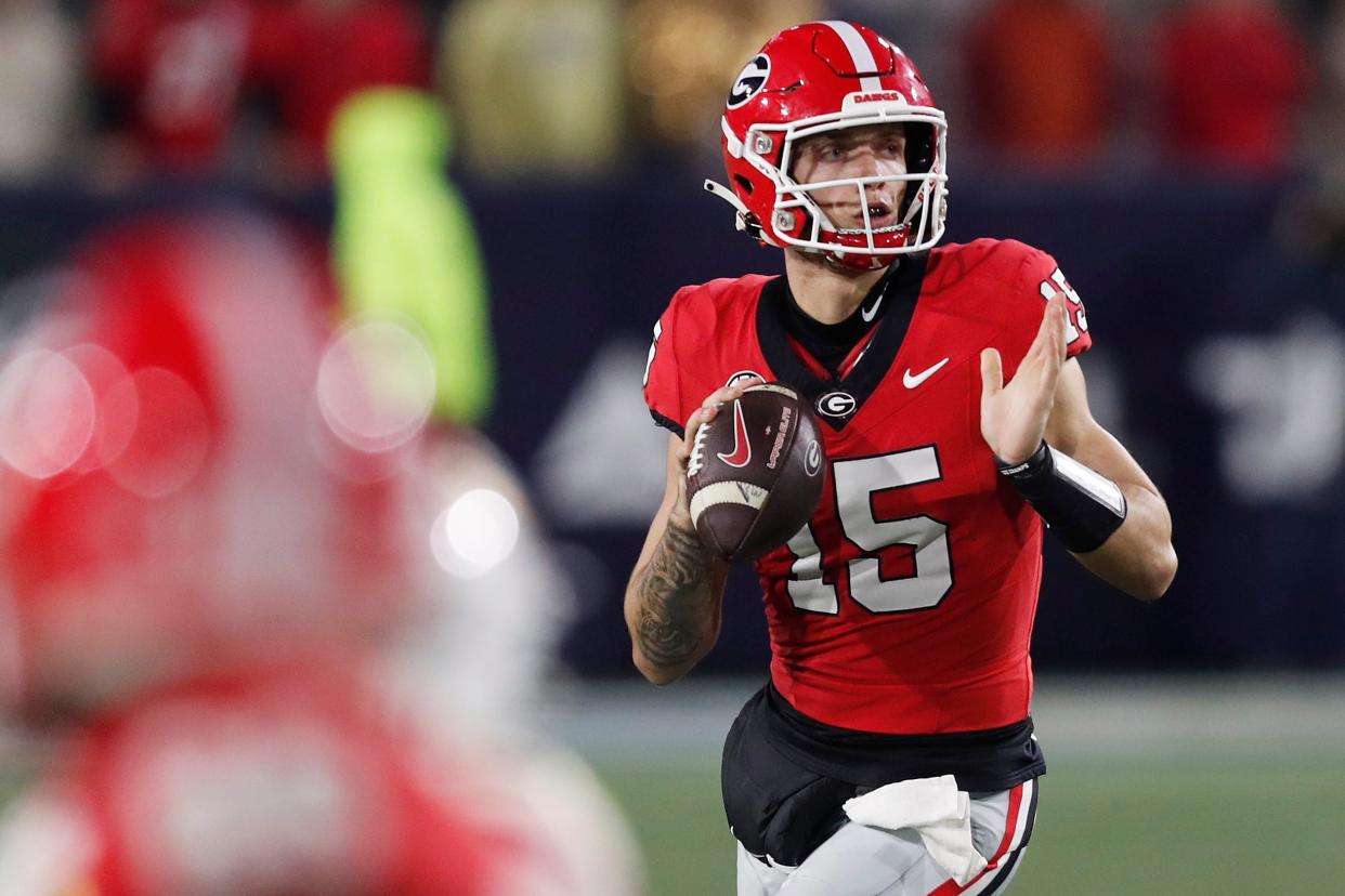 Georgia quarterback Carson Beck (15) looks to throw a pass during the second half of a NCAA college football game against Georgia Tech in Atlanta, on Saturday, Nov. 25, 2023.Georgia won 31-23.