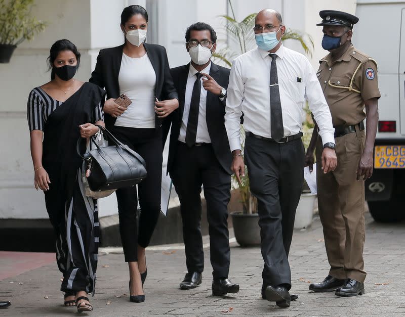 Reigning Mrs World Caroline Jurie leaves the police station in Colombo