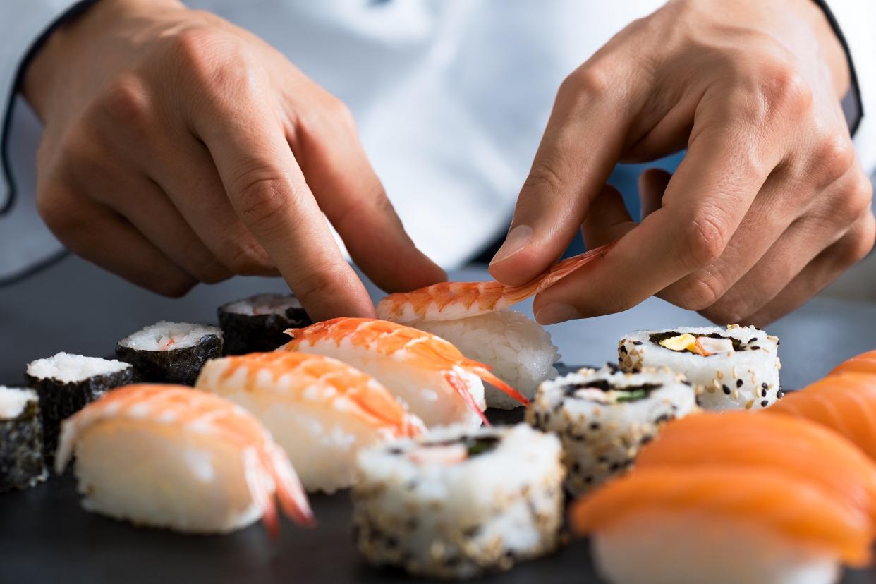 chef preparing sushi