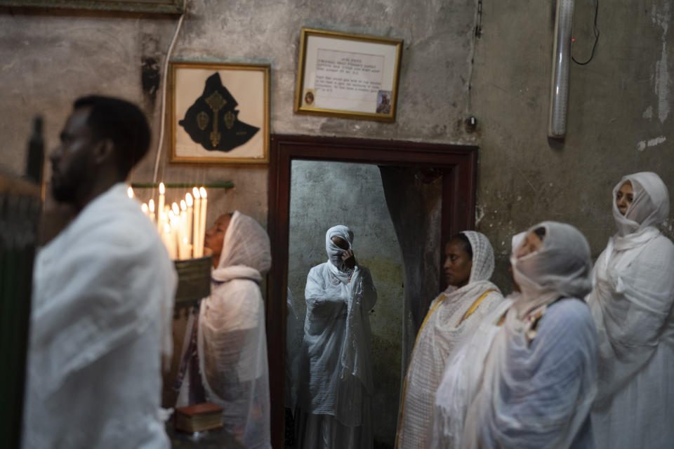 Ethiopian Orthodox Christian worshippers pray during the Washing of the Feet ceremony at the Ethiopian monks' village Deir Al-Sultan, located on the rooftop of the Church of the Holy Sepulchre where many Christians believe Jesus was crucified, buried and rose from the dead, in the Old City of Jerusalem, May 2, 2024. (AP Photo/Leo Correa)