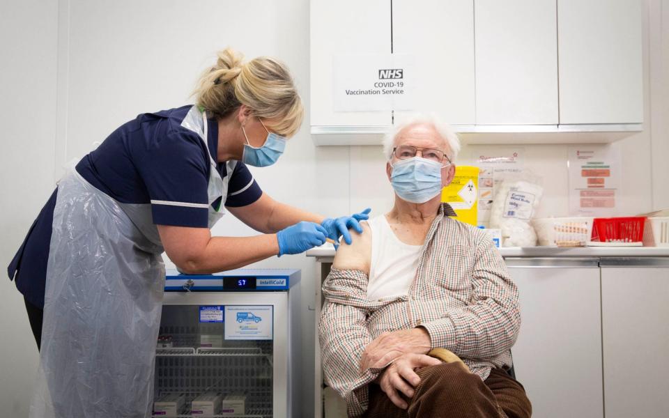 Peter Cast, 87, from Ashtead, is one of the first people to receive the vaccine at Superdrug, in Guildford - Matt Alexander /PA