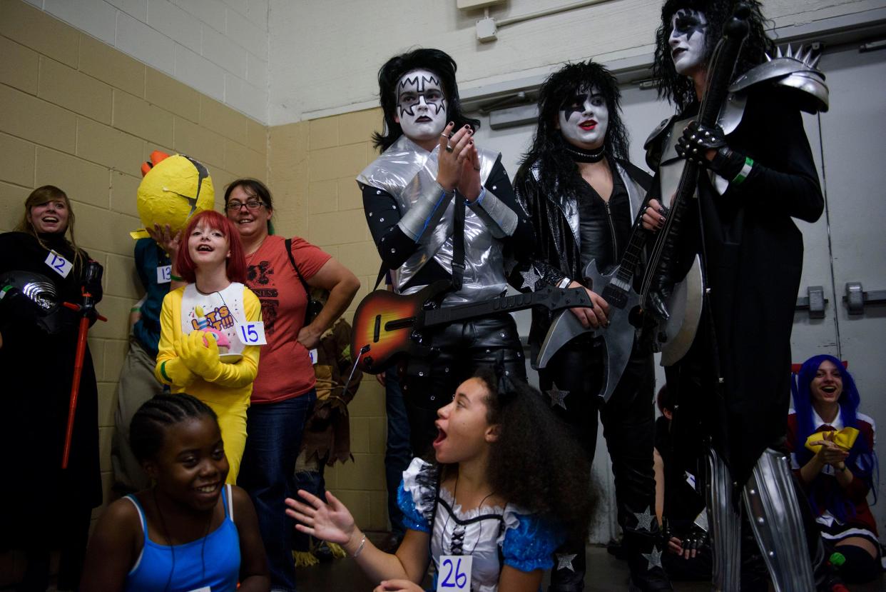 David Gore, Carson Sikorski, left to right, and Mason Oppelt wait with others during a costume contest for kids 16 and under at the 2017 Fayetteville Comic-Con.