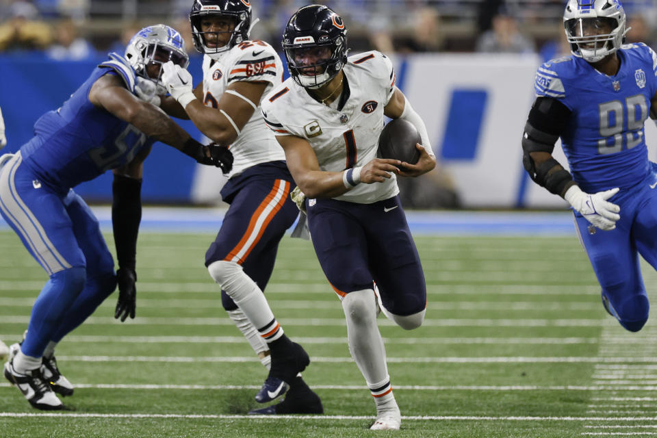 Chicago Bears quarterback Justin Fields (1) scrambles during the second half of an NFL football game against the Detroit Lions, Sunday, Nov. 19, 2023, in Detroit. (AP Photo/Duane Burleson)