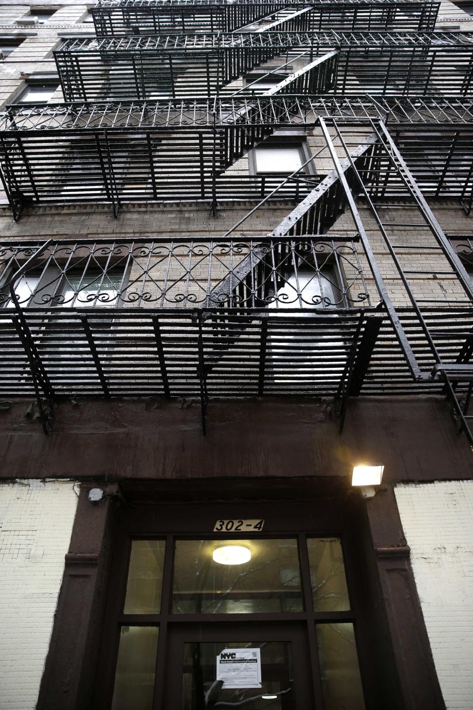 An apartment building at 320 Mott St. is seen in New York, Wednesday, Feb. 5, 2014. Four people are in custody on drug charges after police executed search warrants at three apartments in the building. (AP Photo/Seth Wenig)