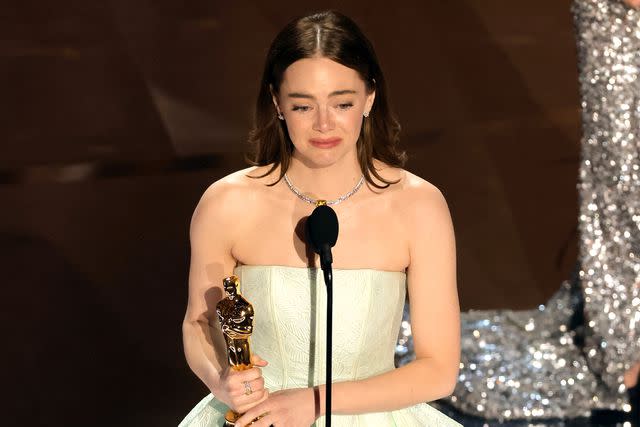 <p>Kevin Winter/Getty Images</p> 'Poor Things' star Emma Stone accepts the award for Best Actress at the 2024 Oscars