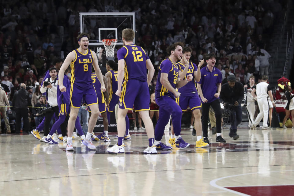 LSU celebrates after upsetting South Carolina during an NCAA college basketball game Saturday, Feb. 17, 2024, in Columbia, S.C. LSU won 64-63. (AP Photo/Artie Walker Jr.)