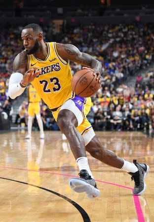 Oct 10, 2018; Las Vegas, NV, USA; Los Angeles Lakers forward LeBron James (23) dribbles during the first half against the Golden State Warriors at T-Mobile Arena. Mandatory Credit: Stephen R. Sylvanie-USA TODAY Sports