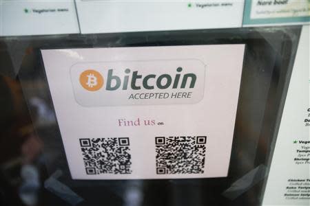 A Bitcoin logo is seen at the window of Nara Sushi, a restaurant that accepts Bitcoin, a form of digital currency, as payment in San Francisco, California in this October 9, 2013, file photo. REUTERS/Stephen Lam/Files