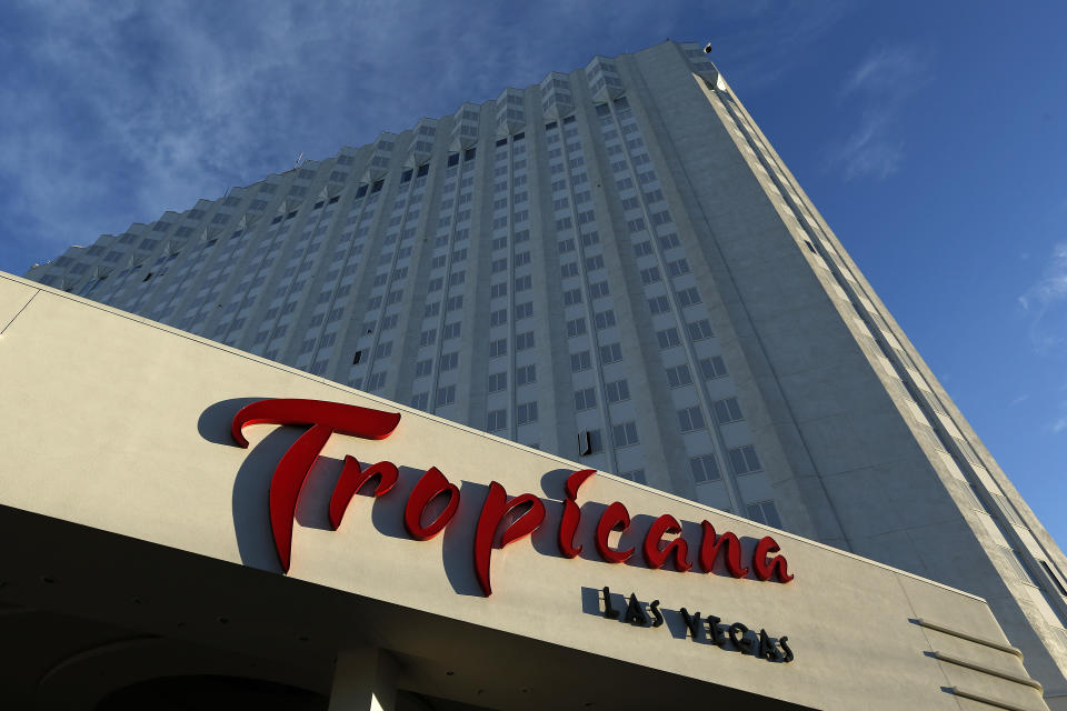 FILE - Sunlight illuminates a sign at The Tropicana hotel and casino in Las Vegas, on Aug. 4, 2015. Some shuffling among owners has some Las Vegas Strip properties destined in coming months for rebranding, demolition, reconstruction and the addition of familiar names. The Tropicana Las Vegas could be demolished or renovated after Bally's Corp., buys the nearly 1,500-room resort. (AP Photo/John Locher, File)