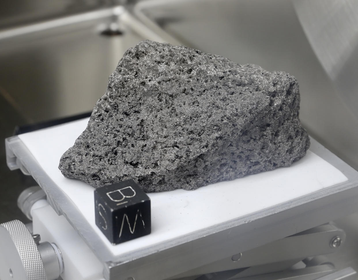 Collected during Apollo 17, a 3.5 billion year old basalt rock known as "The Children of the World" or "The Goodwill Sample" is displayed in the lunar lab at the NASA Johnson Space Center Monday, June 17, 2019, in Houston. It was used for to make samples that were gifted to every country on earth. (Photo: Michael Wyke/AP)