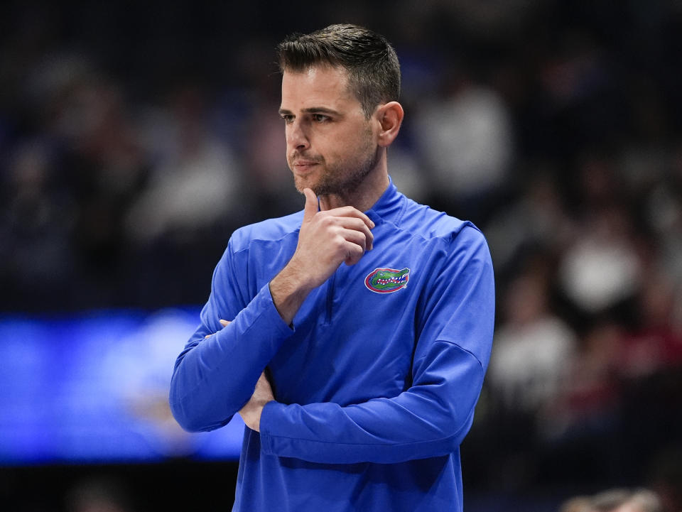 Florida head caoch Todd Golden looks on from the bench during the first half of an NCAA college basketball game against Georgia at the Southeastern Conference tournament Thursday, March 14, 2024, in Nashville, Tenn. (AP Photo/John Bazemore)