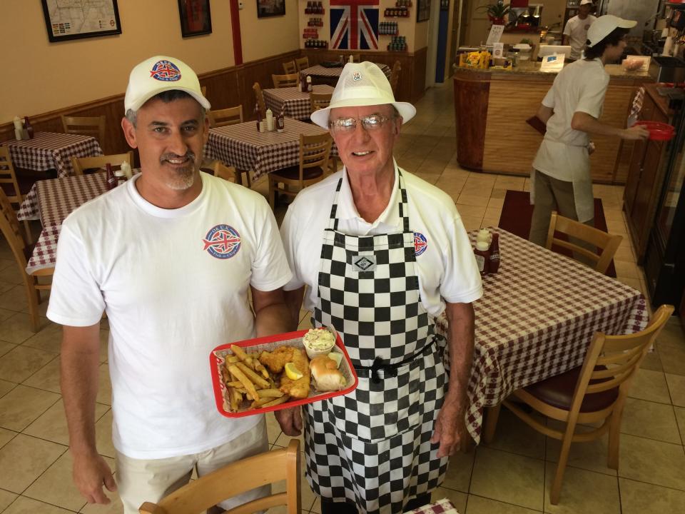 British expat John Norton, right, owns OK UK Fish-n-Chips in North Fort Myers with his son in-law, John Natanni.