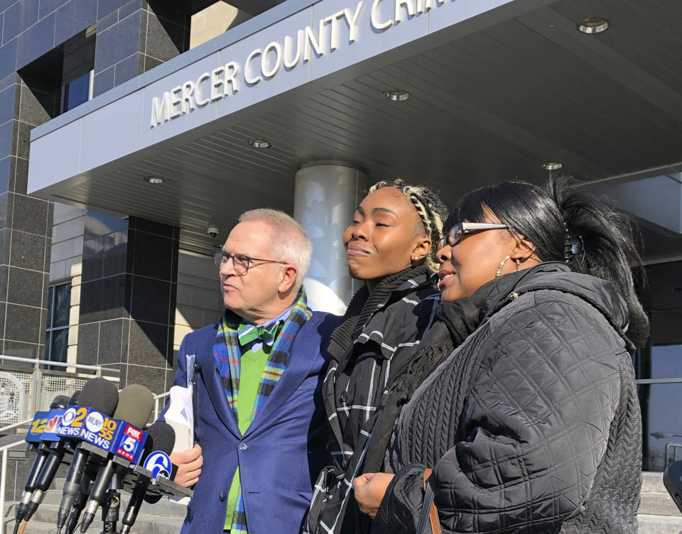 Jazmine Headley, center, joins attorney Brian Neary and her mother, Jacqueline Jenkins, outside a courthouse in Trenton, N.J., after she accepted a deal to enter a pretrial intervention program related to credit card theft charges she faced, Wednesday, Dec. 12, 2018. Headley said she's happy to be reunited with her son after being violently separated from her toddler by New York police in a widely viewed videotaped encounter. (AP Photo/Mike Catalini)