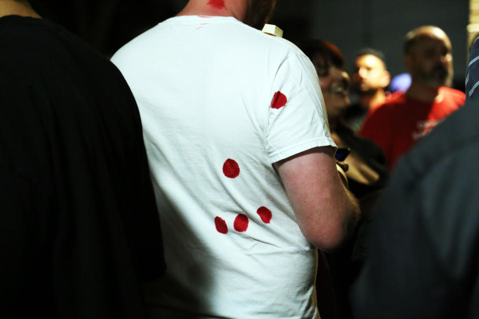 A protester wears a shirt marked with red spots where Stephon Clark was shot by Sacramento police. (Photo: Jenavieve Hatch/HUFFPOST)