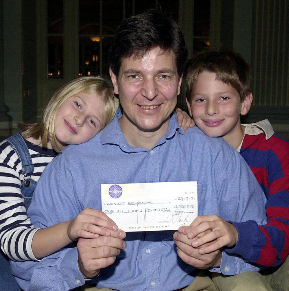 Robert Brydges holds his life-canging cheque in September, 2001. (PA)