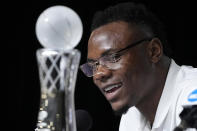 Oscar Tshiebwe of Kentucky speaks as he is introduced as The Associated Press men's basketball player of the year, in New Orleans, Friday, April 1, 2022. The 6-foot-9, 255-pound junior received 46 of 60 votes from a national media panel. Wisconsin's Johnny Davis was second with 10 votes. (AP Photo/Gerald Herbert)