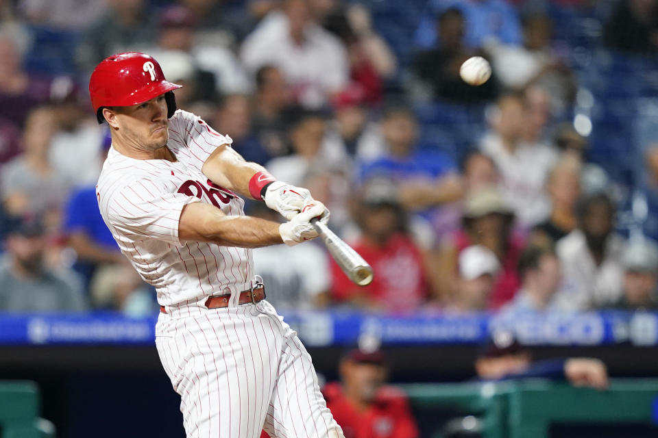 Philadelphia Phillies' J.T. Realmuto hits a two-run home run against Washington Nationals pitcher Erasmo Ramirez during the fifth inning of a baseball game, Tuesday, July 5, 2022, in Philadelphia. (AP Photo/Matt Slocum)