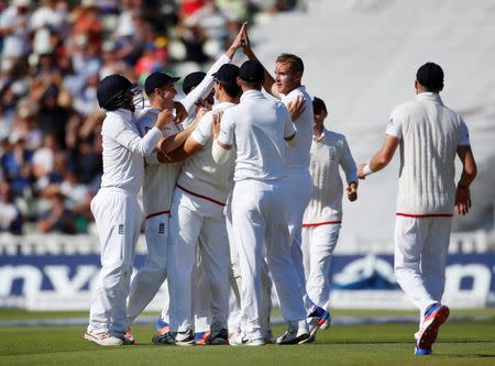 Britain Cricket - England v Pakistan - Third Test - Edgbaston - 7/8/16 England's Stuart Broad celebrates taking the wicket of Pakistan's Mohammad Amir with team mates Action Images via Reuters / Paul Childs