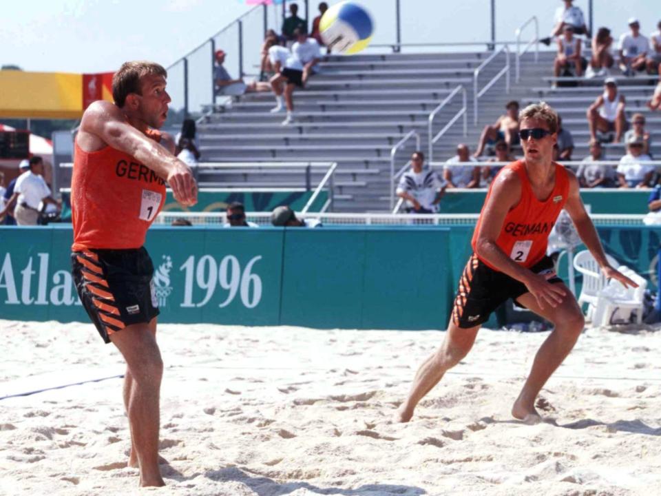 Men playing beach volleyball at the 1996 Olympics (Bongarts/Getty)